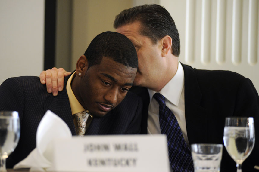Kentucky coach John Calipari, right, whispers into the ear of Kentucky point guard John Wall during a United States Basketball Writers Association breakfast on Friday, April 2, 2010, at the Columbia Club in downtown Indianapolis. Wall was named Freshman of the Year by the association. (James Brosher / IU Student News Bureau)