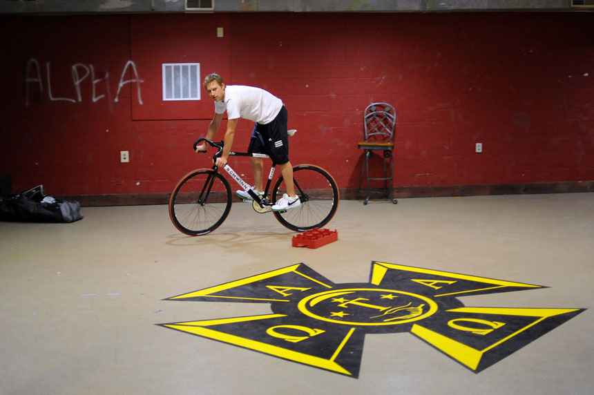 Emanon rider Alex Ray takes a team bicycle for a spin in the basement of the Alpha Tau Omega house on Wednesday, April 21, 2010, in Bloomington, Ind. The team met at the house to do a few last-second tweaks to their bicycles before turning it in for pre-race inspection the next day.