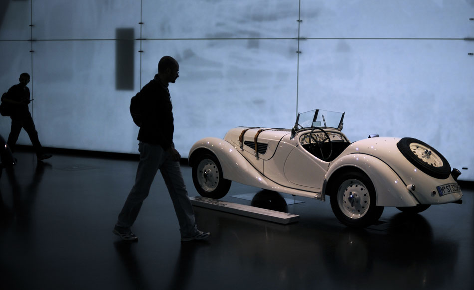 Visitors make their way past a 1936 BMW 328 on Monday, May 24, 2010, in the BMW Museum in Munich, Germany.