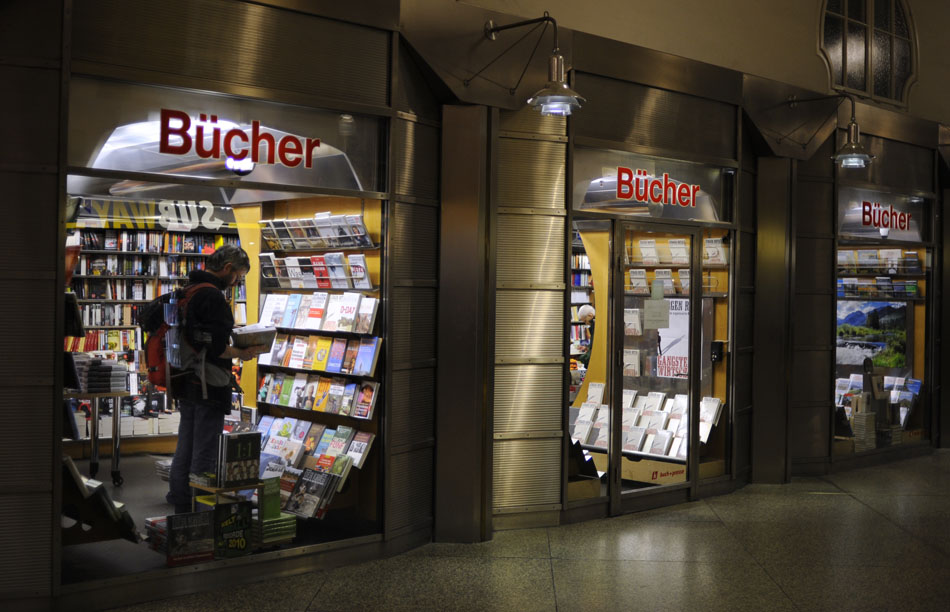 A man browses a selection of books on Friday, May 21, 2010, in Munich's Central Train Station.