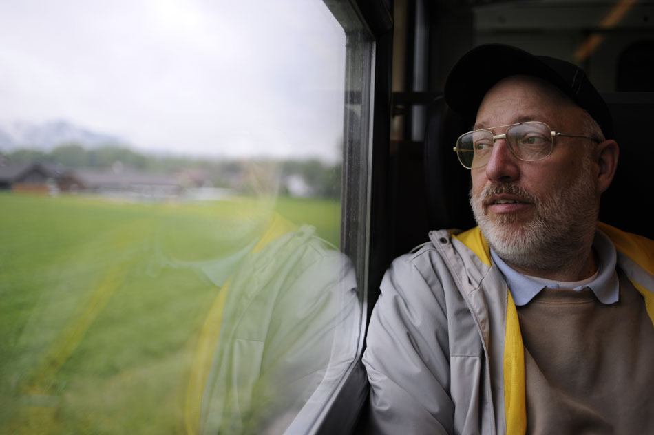 Tom Brosher peers out a window at the passing countryside during a train ride on Friday, May 21, 2010, near the German-Austrian border north of Salzburg, Austria.