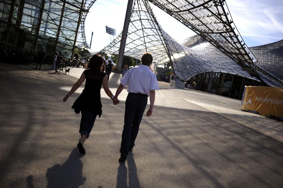 A couple walks through the Olympic Park on Monday, May 24, 2010, in Munich, Germany.