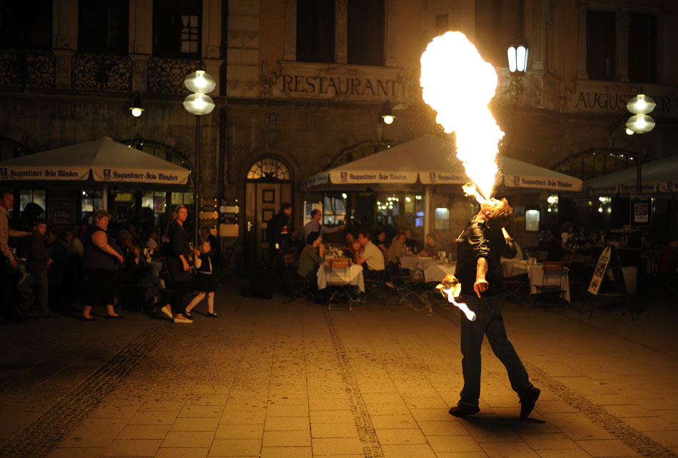 A fire breather performs outside the Augustiner Beer Hall on Monday, May 24, 2010, in Munich, Germany.