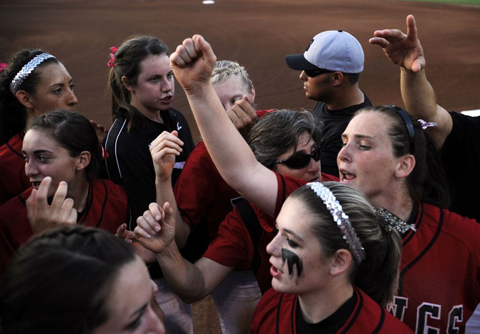Bowie players huddle up before the start of a Class 5A softball semifinal against Tomball at the University of Texas on Friday, June 4, 2010.