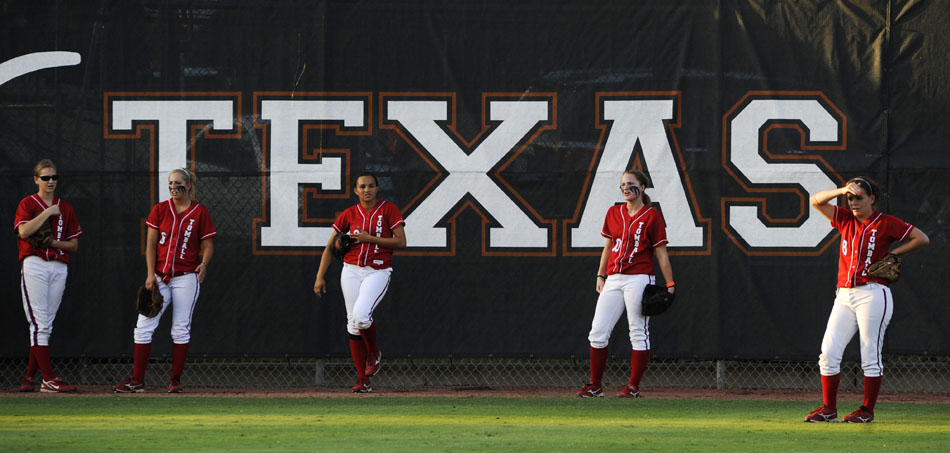 Tomball players warm up in the outfield before a Class 5A softball semifinal against Bowie at the University of Texas on Friday, June 4, 2010.