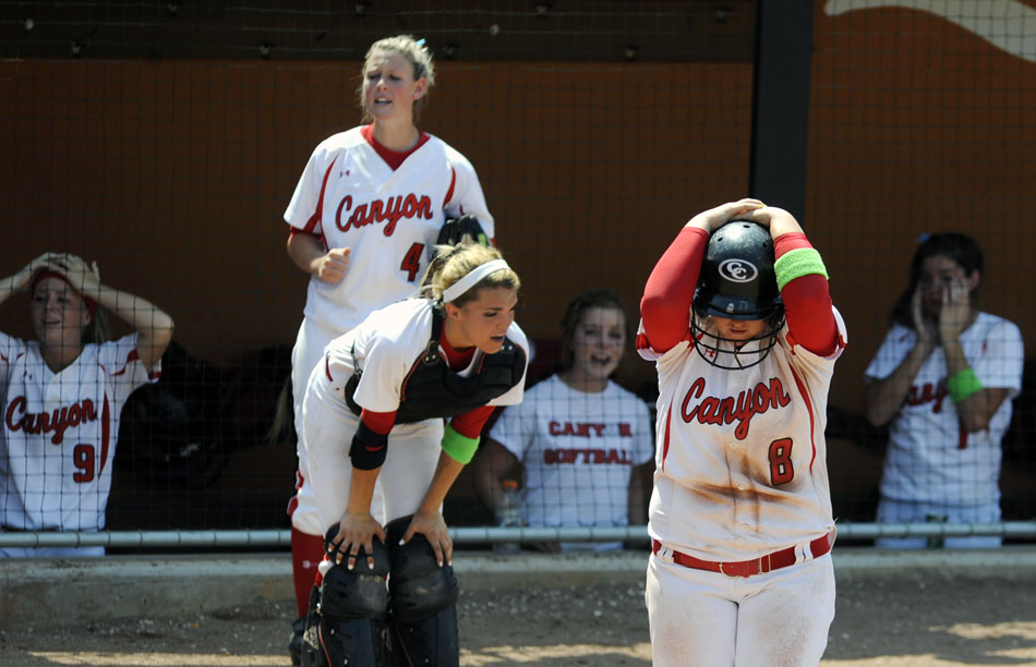Canyon's Aby Kester (8) hangs her head after a Canyon score in the bottom of the 9th inning was called back after a hit fell foul during a 4A softball semifinal against Magnolia at the University of Texas on Friday, June 4, 2010.
