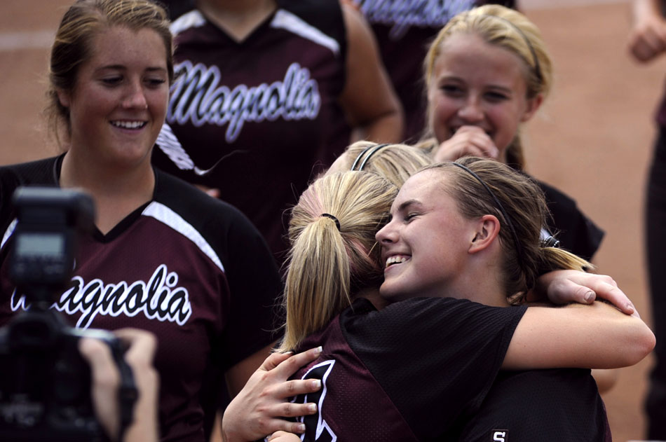 Magnolia's Kassi Mushinski, right, hugs teammate Katy Adair after the team defeated Canyon in a 4A softball semi-final at the University of Texas on Friday, June 4, 2010.