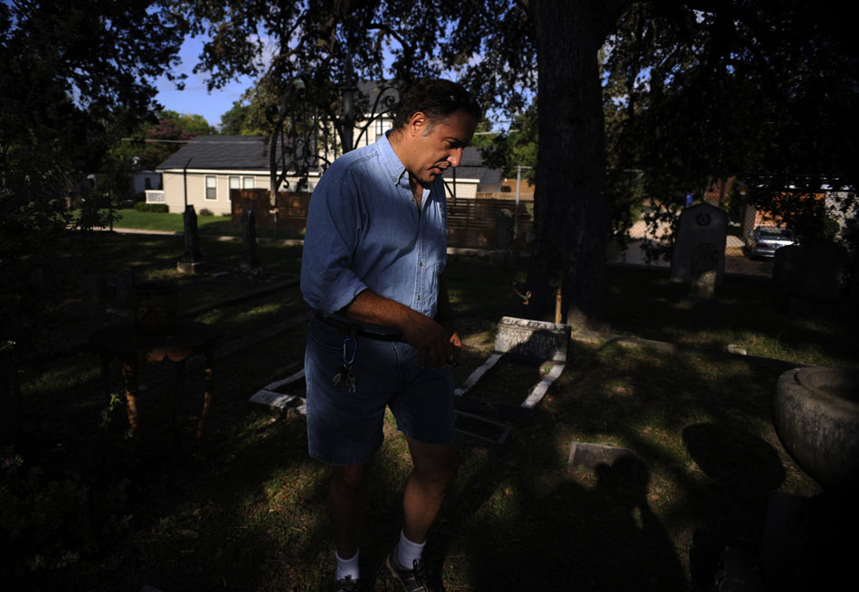 Dale Flatt, an organizer with Save Austin's Cemeteries, walks through an older area of Oakwood Cemetery on Wednesday, June 23, 2010. Flatt, a Austin firefighter, works to preserve and restore old headstones and grave sites through the organization.