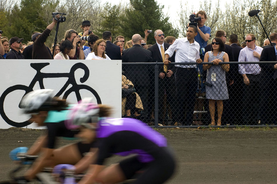 Presidential hopeful Sen. Barack Obama, D-Ill., watches pace laps with Indiana University Student Foundation director Jenny Bruffey, right, before the start of the women's Little 500 bicycle race on Friday, April 11, 2008, at Bill Armstrong Stadium. Obama walked around the track and greeted each team before the  race.