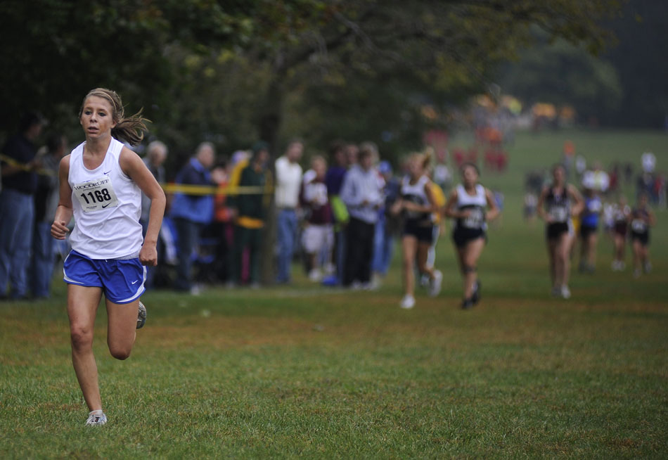 Freeburg's Kristen Busch breaks away from the pack as she runs in a Class 1A race during the Woodruff Cross Country on Saturday, Sept. 11, 2010, in Detweiller Park.