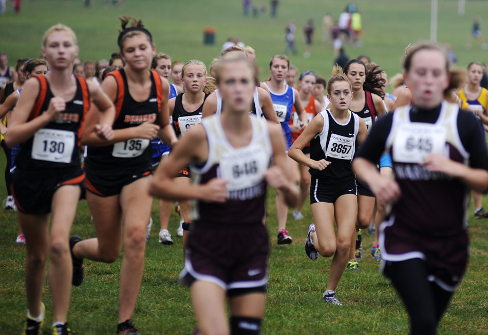 A pack of girls make their way around the course in a Class 1A race during the Woodruff Cross Country on Saturday, Sept. 11, 2010, in Detweiller Park.