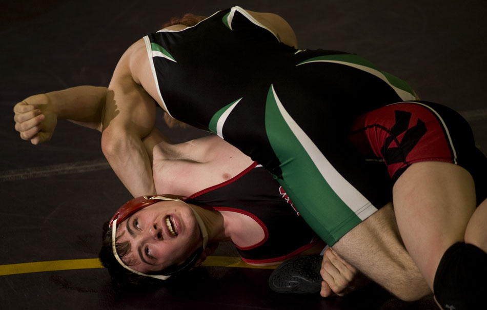 Springfield's Kris Kramer reacts as he fights off a pin from Eureka's Chris Griffieth during a tournament on Saturday, Dec. 4, 2010, at Notre Dame High School.