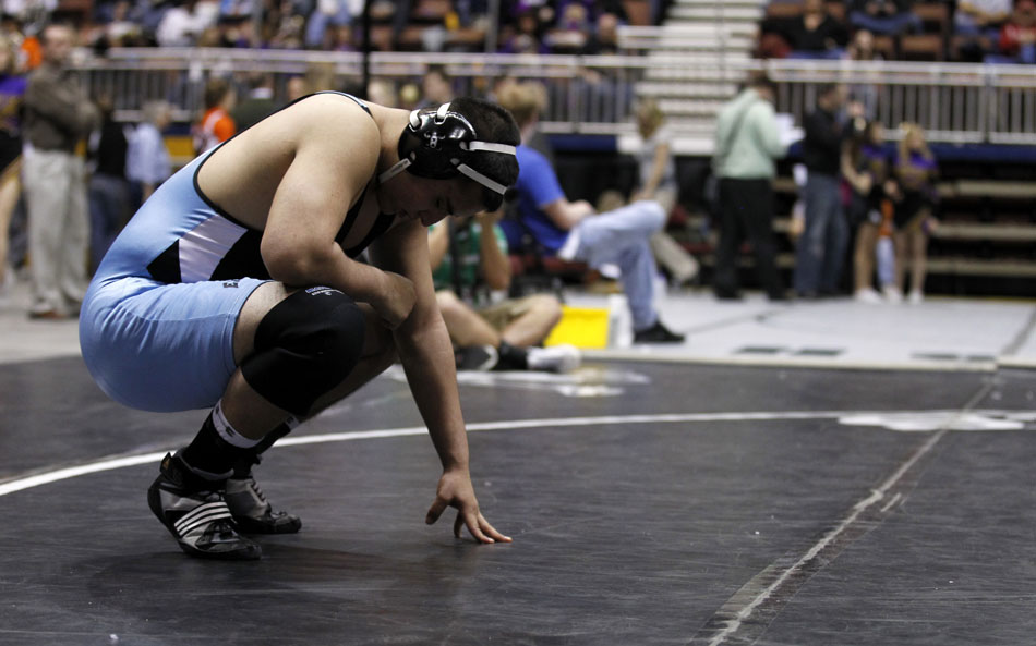 Cheyenne East's Michael Galicia takes a moment before facing Laramie's Wes Dalles in the Class 4A 215-pound third place match during the Wyoming high school state wrestling tournament on Saturday, Feb. 26, 2011, in Casper, Wyo.