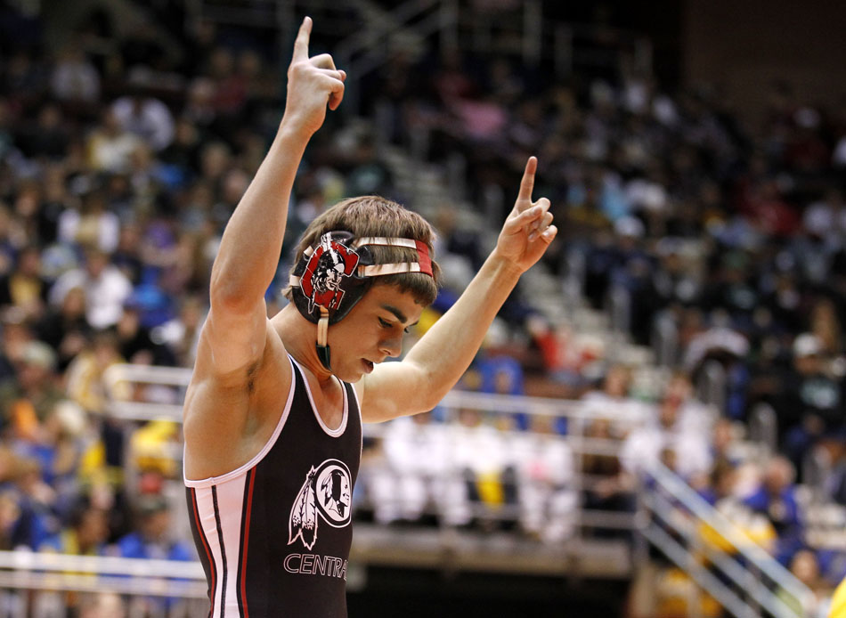 Cheyenne Central's Bryce Meredith celebrates a win against Star Valley's Mitch Heap during the 103 pound Class 4A championship match on Saturday, Feb. 26, 2011, in Casper, Wyo.