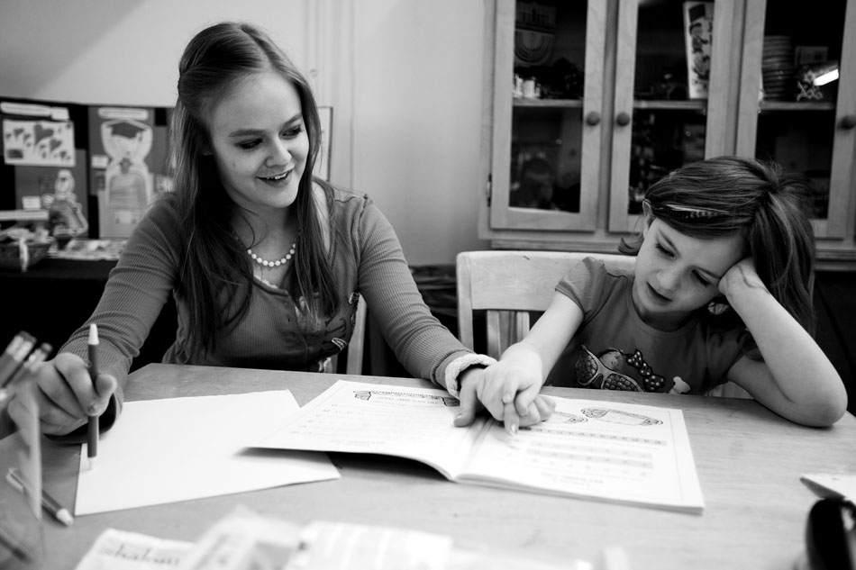 Nathalia Rap, age 16, helps Zoey Brown, age 5, sound out a letter in Hebrew on Sunday, Feb. 27, 2011, at the Mount Sinai Congregation in Cheyenne.