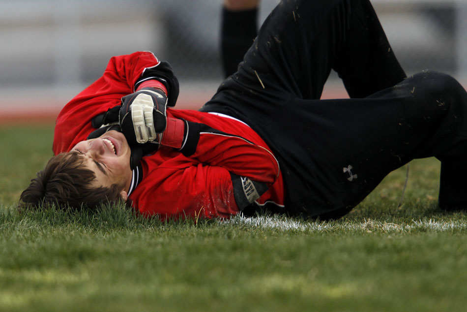Gillette keeper Jordan Rueschoff holds his hand in pain after a collision with a Cheyenne East player during a boy's soccer regional game on Thursday, May 12, 2011, at Cheyenne South High School.