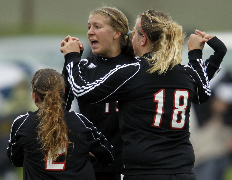 Cheyenne Central's Christie Schiel celebrates with teammates after a goal during a girl's state soccer quarterfinal on Thursday, May 19, 2011, in Sheridan, Wyo.