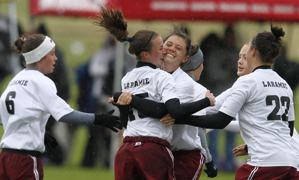 Laramie's Haley Moon celebrates with teammate Megan Dooley, back to camera, after Dooley scored a goal during a Class 4A girl's state soccer semifinal on Friday, May 20, 2011, in Sheridan, Wyo.