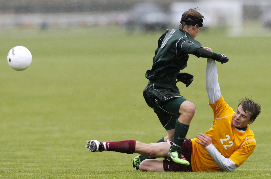 Kelly Walsh's Matt Binder (3) throws Laramie's Dillon Barbour to the pitch during a Class 4A boy's state soccer semifinal on Friday, May 20, 2011, in Sheridan, Wyo.