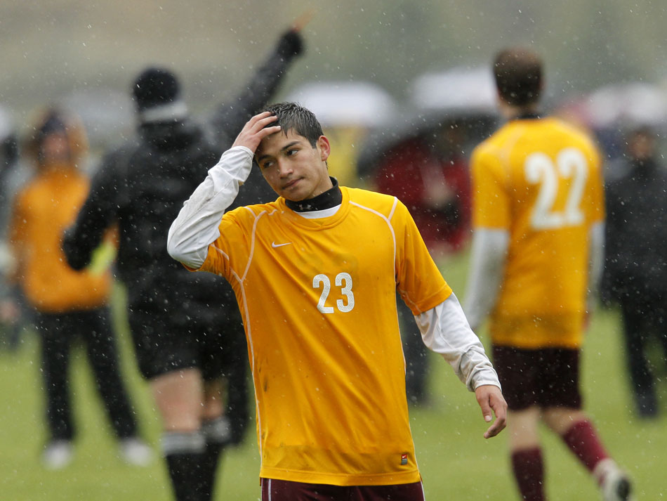 Laramie's Jimi Gomez reacts as an official issues a red card to teammate Andrew Johnson and coach Andy Pannell during a Class 4A boy's state soccer semifinal on Friday, May 20, 2011, in Sheridan, Wyo. Laramie played without its coach and down a player for most of the game, but came back to win 3-2.