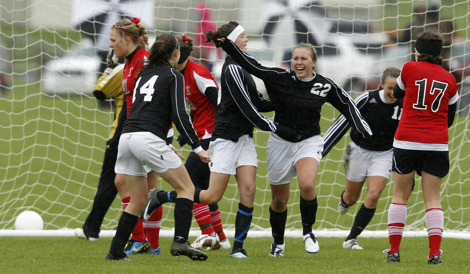 Cheyenne East's Brittney Rexius (22) celebrates with her teammates after she scored a goal against Cheyenne Central during a Class 4A girl's state soccer third place game on Saturday, May 21, 2011, in Sheridan, Wyo.