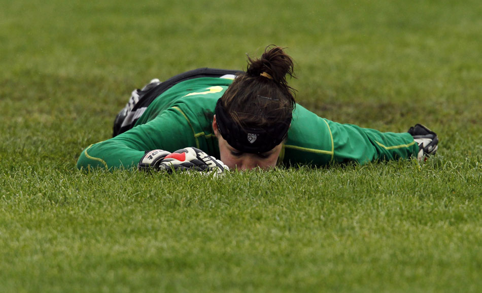 Laramie keeper Rachel Rettinger lies on the soggy pitch after allowing a goal during penalty kicks overtime in the Class 4A girl's state soccer championship game against Gillette on Saturday, May 21, 2011, in Sheridan, Wyo. Laramie lost in a shootout 2-1 (3-1).