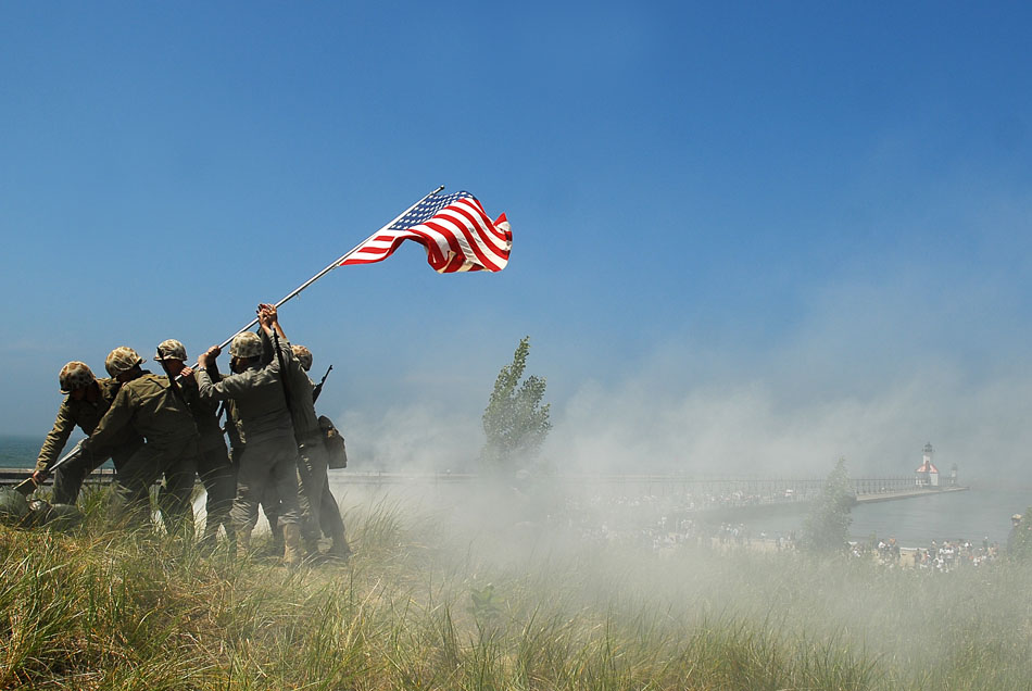 U.S Marine re-enactors portray the famous Iwo Jima flag raising after re-enactments of of D-Day and Pacific Theater landings on Saturday, June 20, 2009 at Tiscornia Beach in St. Joseph, Mich. (James Brosher/South Bend Tribune)