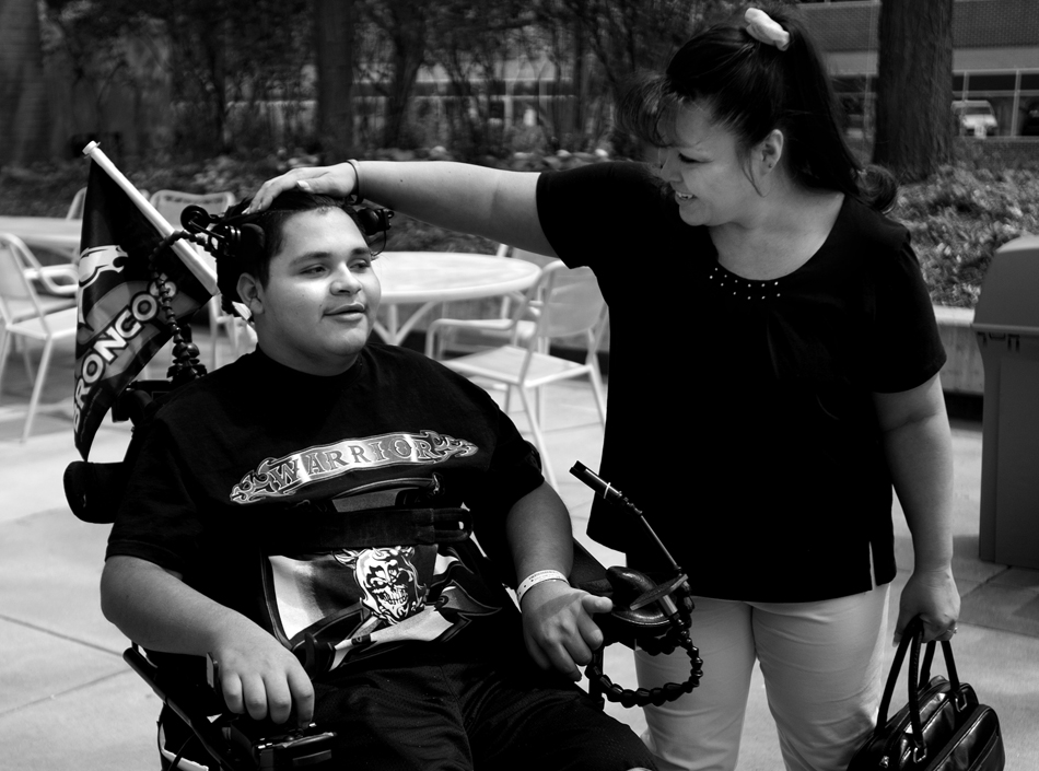 Melissa Plumley shares a laugh with her son, Isaac Salas on Friday, May 6, 2011, at Craig Hospital in Englewood, Colo. After his injury and eventual move to Craig Hospital, Melissa rented an apartment on the east side of the hospital, spending time with Isaac as he went about his recovery and physical therapy. She typically making trips back to Cheyenne once a week on Fridays. (James Brosher/Wyoming Tribune Eagle)