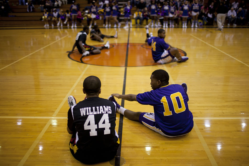 Clay's Emeka Andrews (10) talks with Elkhart Memorial's Darien Williams (44) as the two stretch at half court before a high school basketball game on Tuesday, Feb. 21, 2012, at Clay High School in South Bend. (James Brosher/South Bend Tribune)