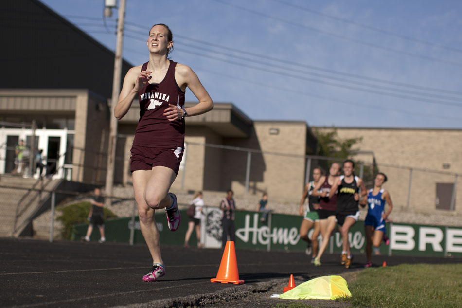 Mishawaka's Jessica Balko takes the lead on the final lap of the 1600 meter run en route to victory during the Bremen girl's track and field sectionals on Tuesday, May 15, 2012, at Bremen High School. (James Brosher/South Bend Tribune)