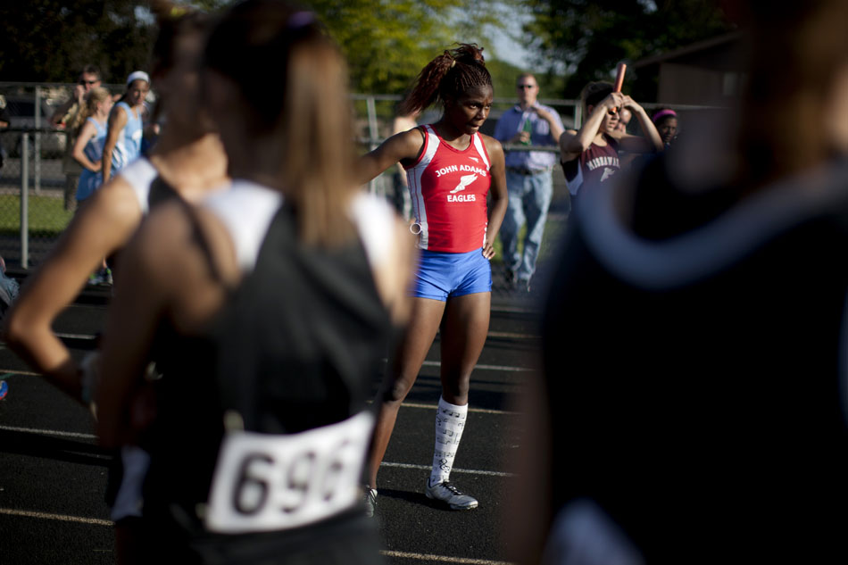 Adams' Aaliyah McKinney waits at the finish line with fellow runners for final results after the 400 meter relay during the Bremen girl's track and field sectionals on Tuesday, May 15, 2012, at Bremen High School. (James Brosher/South Bend Tribune)