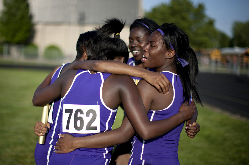 Clay's Ciera Davis, right, celebrates with her teammates after the 400 meter relay during the Bremen girl's track and field sectionals on Tuesday, May 15, 2012, at Bremen High School. (James Brosher/South Bend Tribune)