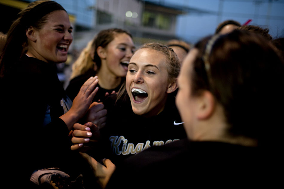 Penn players celebrate with teammate Monica Smith after the final out in a win against Mishawaka in a softball sectional game on Tuesday, May 22, 2012, at Penn High School in Mishawaka. (James Brosher/South Bend Tribune)