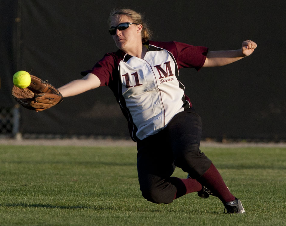 Mishawaka's Jordan Pallo snags a would-be hit in the outfield during a softball sectional game on Tuesday, May 22, 2012, at Penn High School in Mishawaka. (James Brosher/South Bend Tribune)
