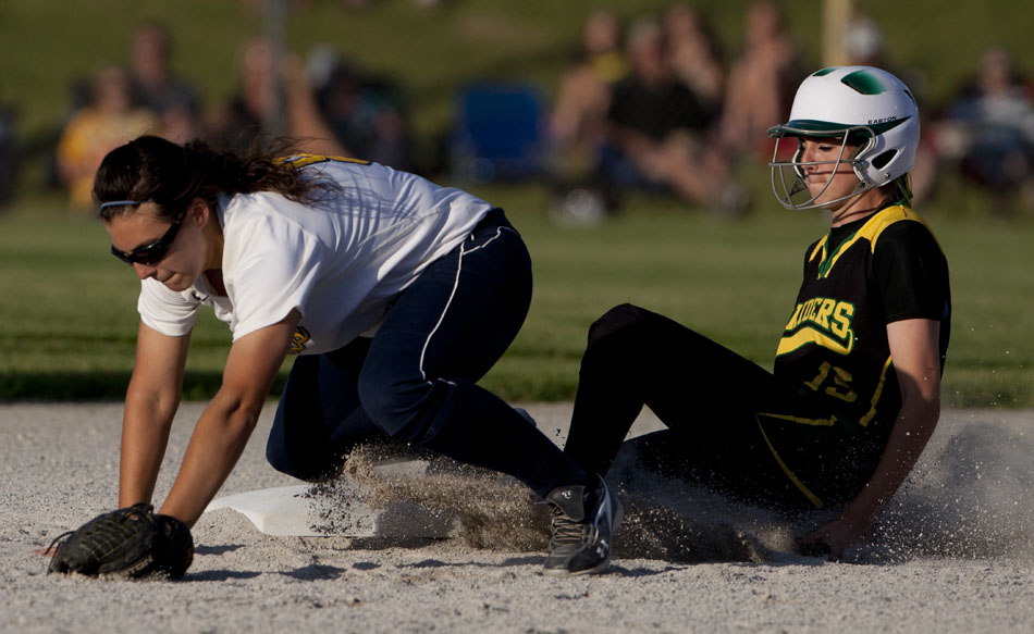 Northridge's Jaymee Bowers, right, slides safely into second as Riley's Angela Danielli tries to corral a throw from the outfield during a Class 4A softball regional final on Tuesday, May 29, 2012, at Riley High School in South Bend. (James Brosher/South Bend Tribune)