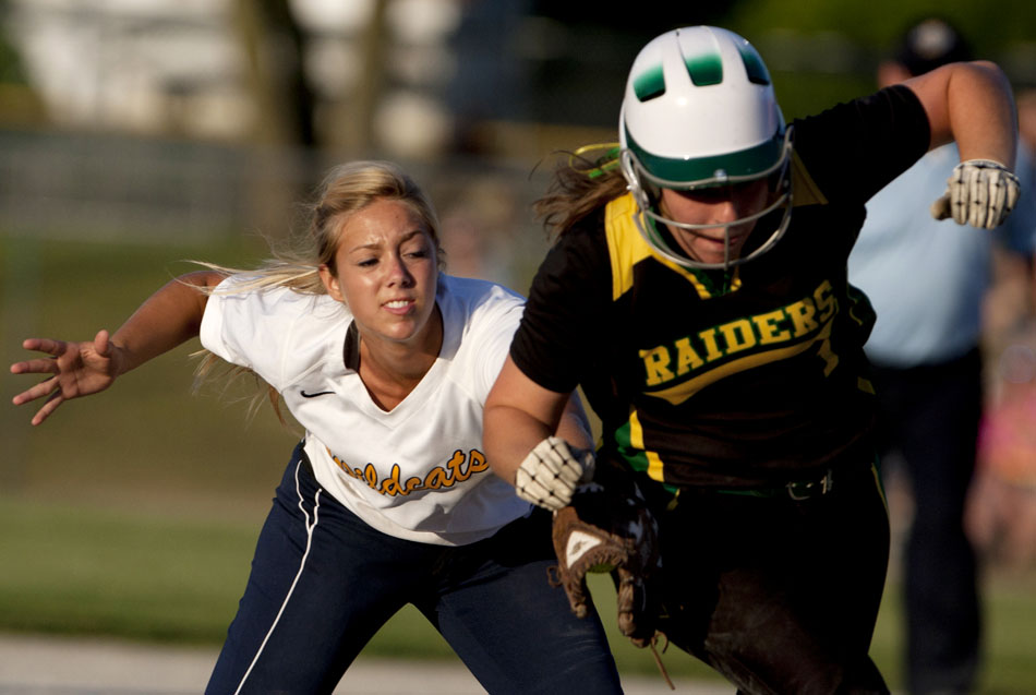 Riley's Allison Luft, left, applies the tag to Northridge's Madison Schrock between second and third during a Class 4A softball regional final on Tuesday, May 29, 2012, at Riley High School in South Bend. (James Brosher/South Bend Tribune)
