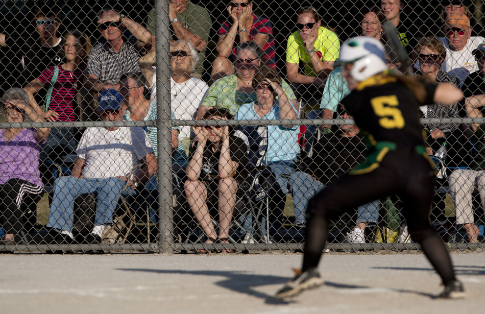 Northridge fans watch as Cooner Crist eyes a pitch during a Class 4A softball regional final on Tuesday, May 29, 2012, at Riley High School in South Bend. (James Brosher/South Bend Tribune)