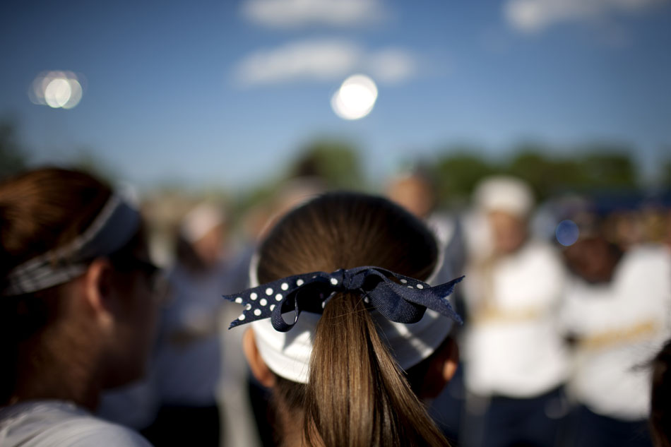 A Riley player wears a bow in her hair with the school's colors before a Class 4A softball regional final on Tuesday, May 29, 2012, at Riley High School in South Bend. (James Brosher/South Bend Tribune)