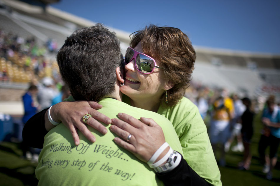 Kimmie Trethewey shares a hug with a member of her walking group after finishing the Sunburst 5K Walk on Saturday, June 2, 2012, at Notre Dame Stadium. (James Brosher/South Bend Tribune)