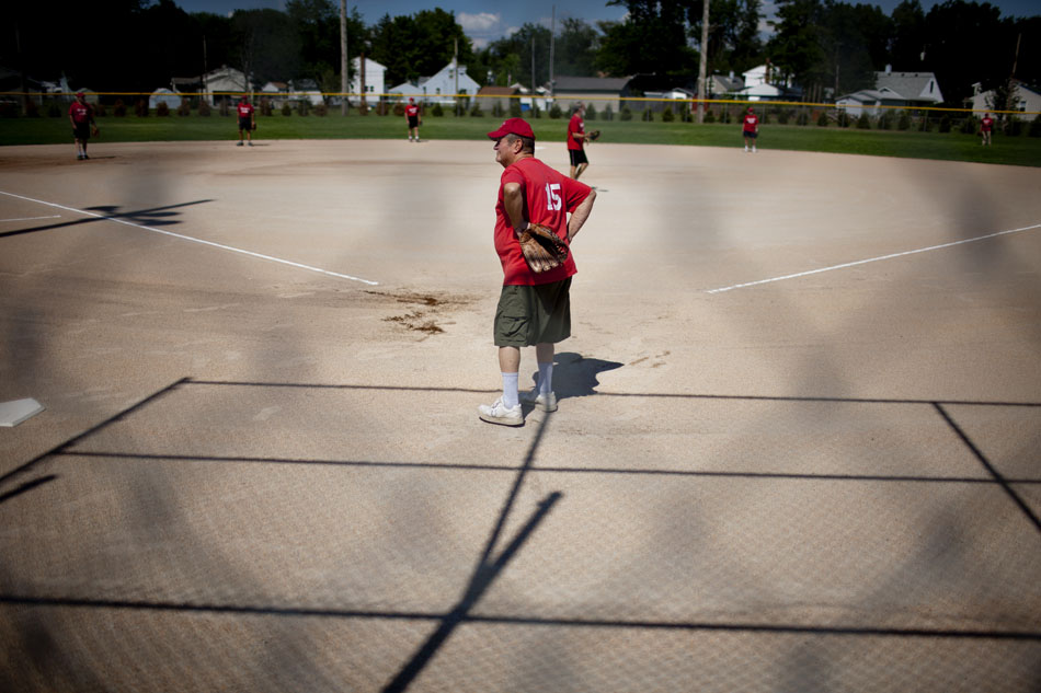 Carl Montgomery, catcher for the Irene's Cafe team, waits at home plate for a batter during a Mishawaka senior softball league game on Tuesday, July 31, 2012, at Normain Park in Mishawaka. At 77 Montgomery is one of the oldest members of the team, all of whom must be 62 or older to participate in the league. (James Brosher/South Bend Tribune)