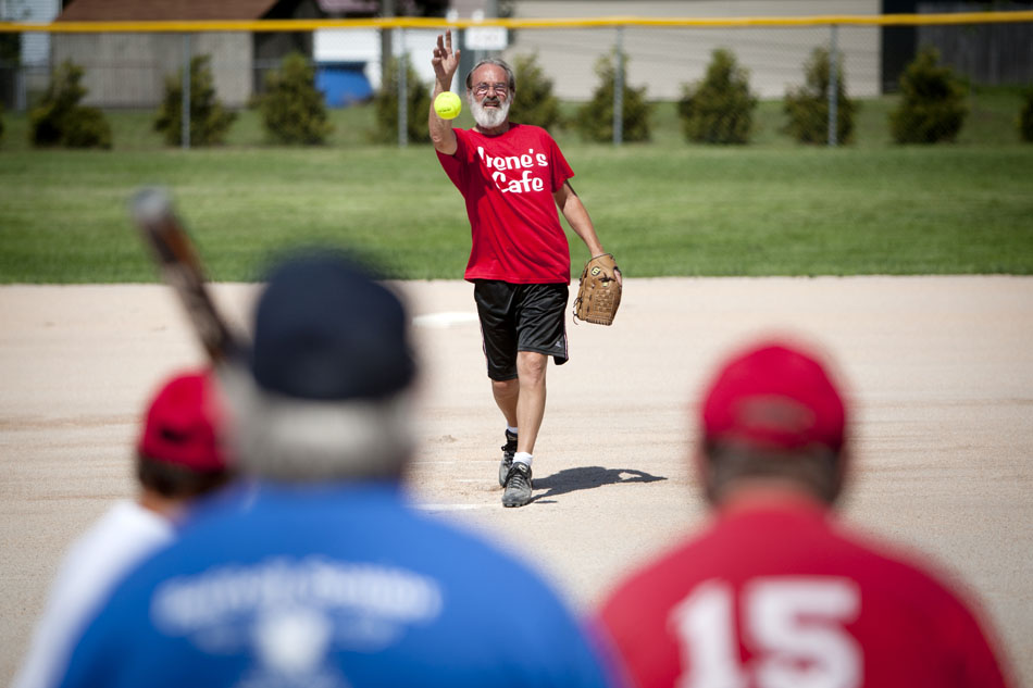 Jeff Chamberlin, a player on the Irene's Cafe team, pitches during a Mishawaka senior softball league game on Tuesday, July 31, 2012, at Normain Park in Mishawaka. The league is for players 62 and older. It features a wide first base, and two home plates to help the older players avoid collisions. (James Brosher/South Bend Tribune)