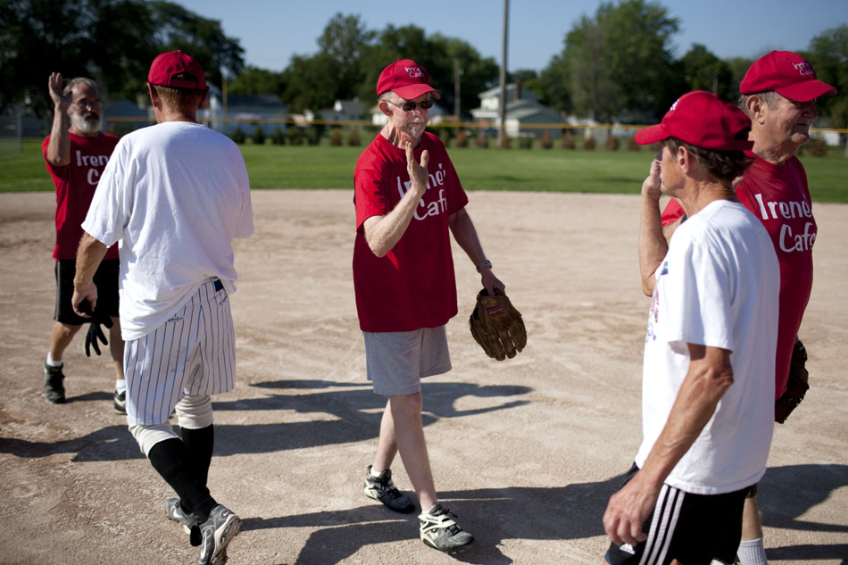 After a victory, the Irene's Cafe team high fives the opposing team after a Mishawaka senior softball league game on Tuesday, July 31, 2012, at Normain Park in Mishawaka. (James Brosher/South Bend Tribune)