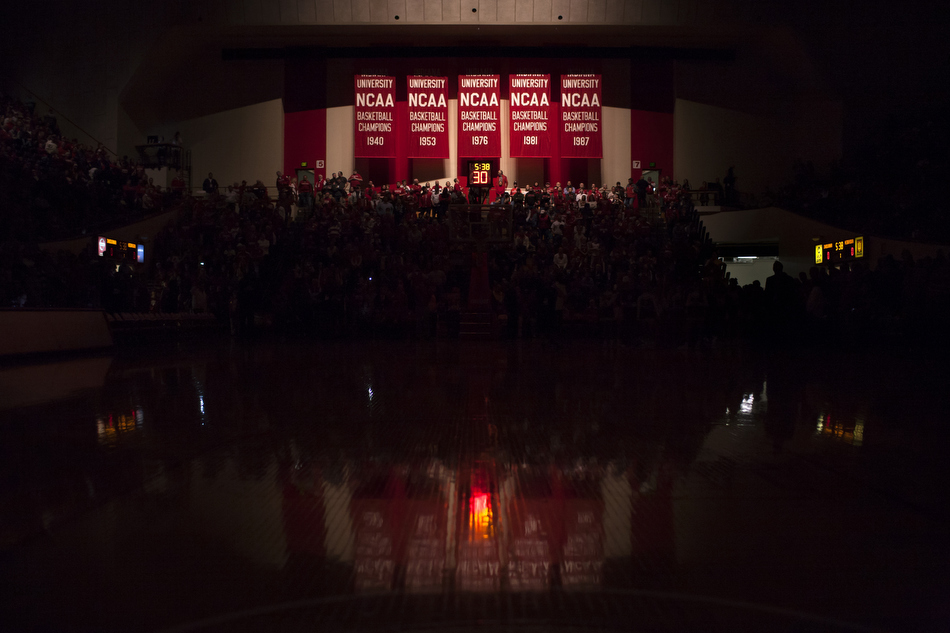 Indiana's national championship banners are illuminated by spotlights before players make their way to the court for a NCAA men's basketball game against Nebraska on Wednesday, Feb. 17, 2016, at Assembly Hall in Bloomington. (James Brosher/IU Communications)