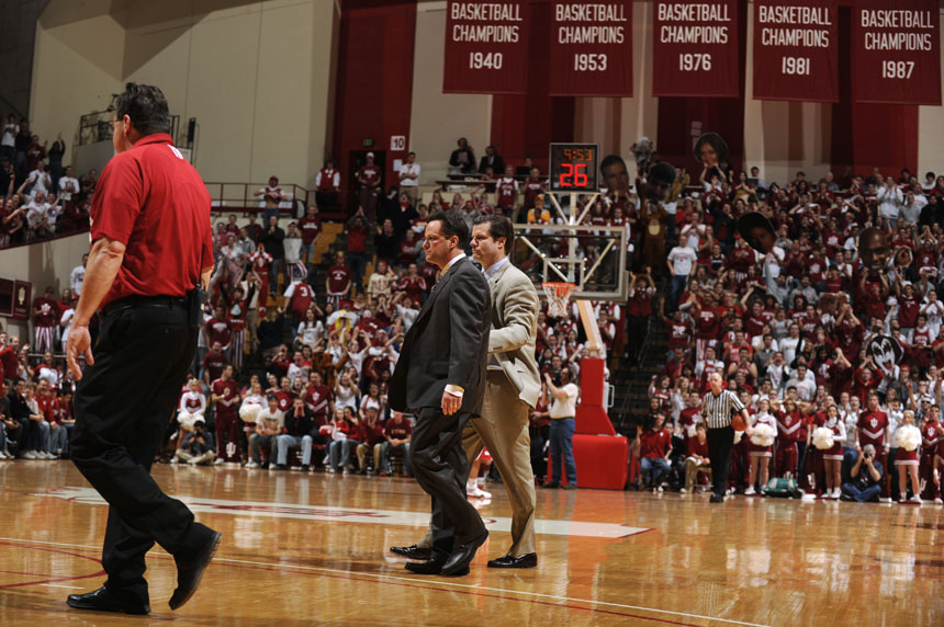 Indiana coach Tom Crean is walked off the floor by assistant coach Tim Buckley, right, after receiving two technicals with 9:53 remaining in a game against Wisconsin on Thursday, Feb. 25, 2010, at Assembly Hall in Bloomington, Ind. IU lost 78-46.