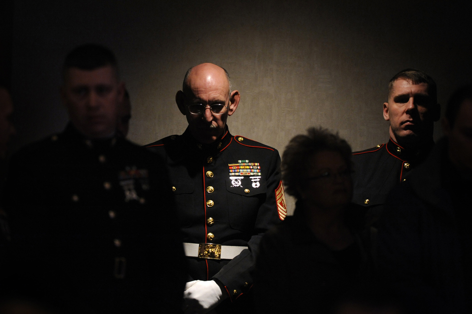 Master Gunnery Sgt. John Lund, a member of the Marine honor guard, listens to a memorial ceremony for Sgt. Jeremy McQueary on Sunday, Feb. 28, 2010, at The Seasons Lodge and Conference Center in Nashville, Ind. Lund, a veteran of the Vietnam War, Gulf War and Iraqi War, folded a flag in McQueary's ceremony. McQueary, 27, was killed in the Helmand Province in Afghanistan on Feb. 18.