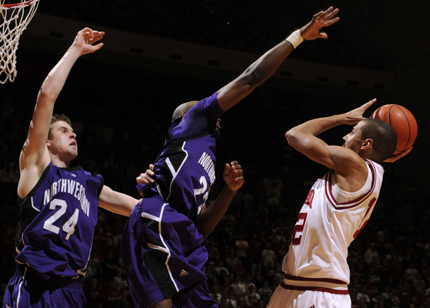 IU guard Verdell Jones III looks to score as Northwestern forward John Shurna (24) and guard Jeremy Nash (23) defend the shot during a game on Saturday, March 6, 2010, at Assembly Hall.