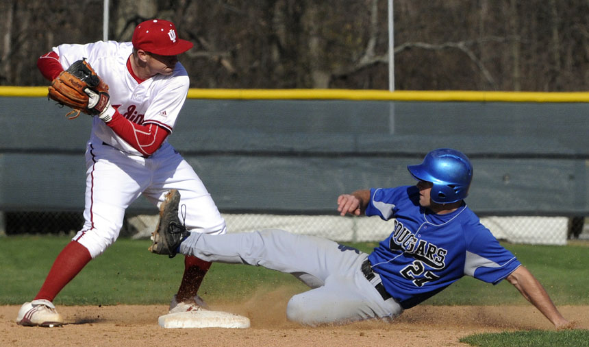 Indiana's Jerry Kleman, left, tags second and looks to fire to first for a double play as St. Francis' Travis Potchka slides into second during a game on Friday, March 26, 2010, at Sembower Field.