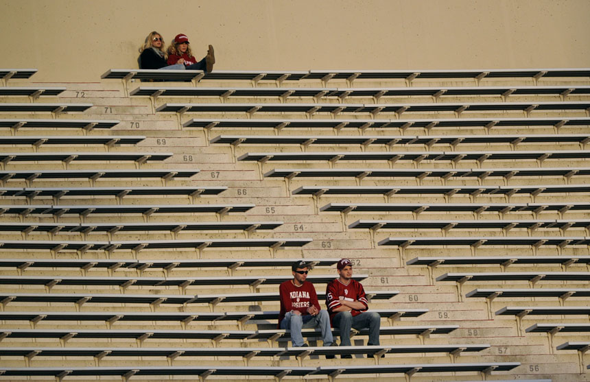 A few fans watch the action from atop the East side of the stadium during the IU Cream and Crimson game on Saturday, April 17, 2010, at Memorial Stadium in Bloomington, Ind. IU reported a record turnout for the event.