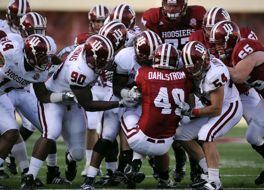 Indiana Cream players gang tackle Griffen Dahlstrom (49) during the IU Cream and Crimson game on Saturday, April 17, 2010, at Memorial Stadium in Bloomington, Ind. Crimson won 17-10.