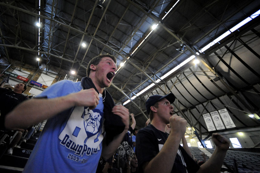 Kyle Faulker, left, and Gage Martin, both freshmen at Butler, react as they watch the closing seconds of Butler's 52-50 win against Michigan State during a watching party at Hinkle Fieldhouse in Indianapolis. (James Brosher / IU Student News Bureau)